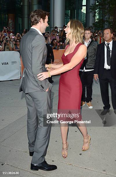 Actress Emily Blunt and husband actor John Krasinski attend the "Looper" opening night gala premiere during the 2012 Toronto International Film...