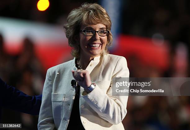 Former U.S. Rep. Gabrielle Giffords stands on stage during the final day of the Democratic National Convention at Time Warner Cable Arena on...