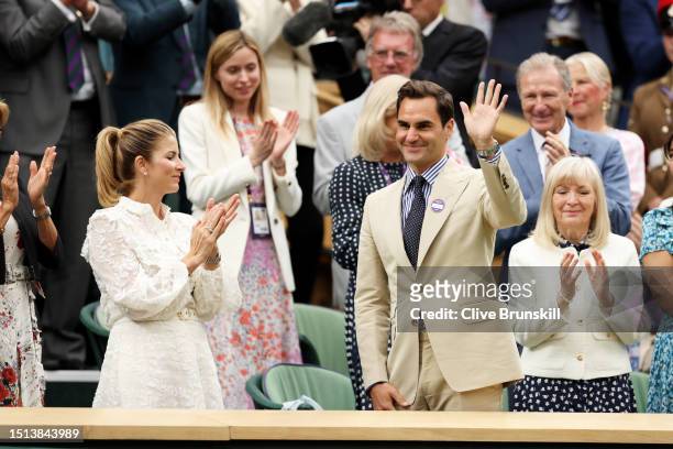 Former Wimbledon Champion, Roger Federer of Switzerland is honoured with his wife, Mirka Federer in the Royal Box prior to the Women's Singles first...