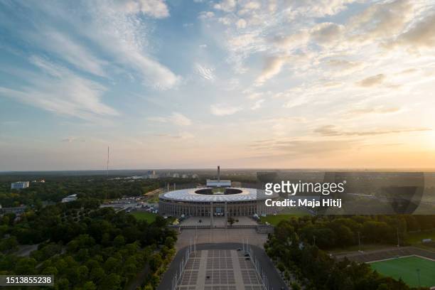 In an aerial view, the Olympic Stadium Berlin stands at sunset on July 02, 2023 in Berlin, Germany.