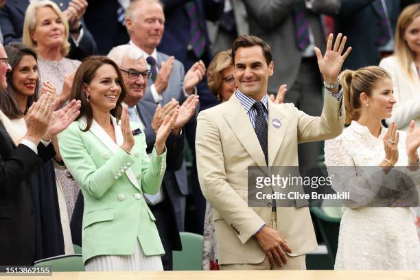 Catherine, Princess of Wales, former Wimbledon Champion, Roger Federer of Switzerland and his wife Mirka Federer interact in the Royal Box prior to...