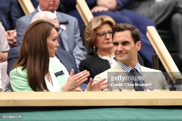 Catherine, Princess of Wales andformer Wimbledon Champion Roger Federer of Switzerland interact in the Royal Box prior to the Women's Singles first...