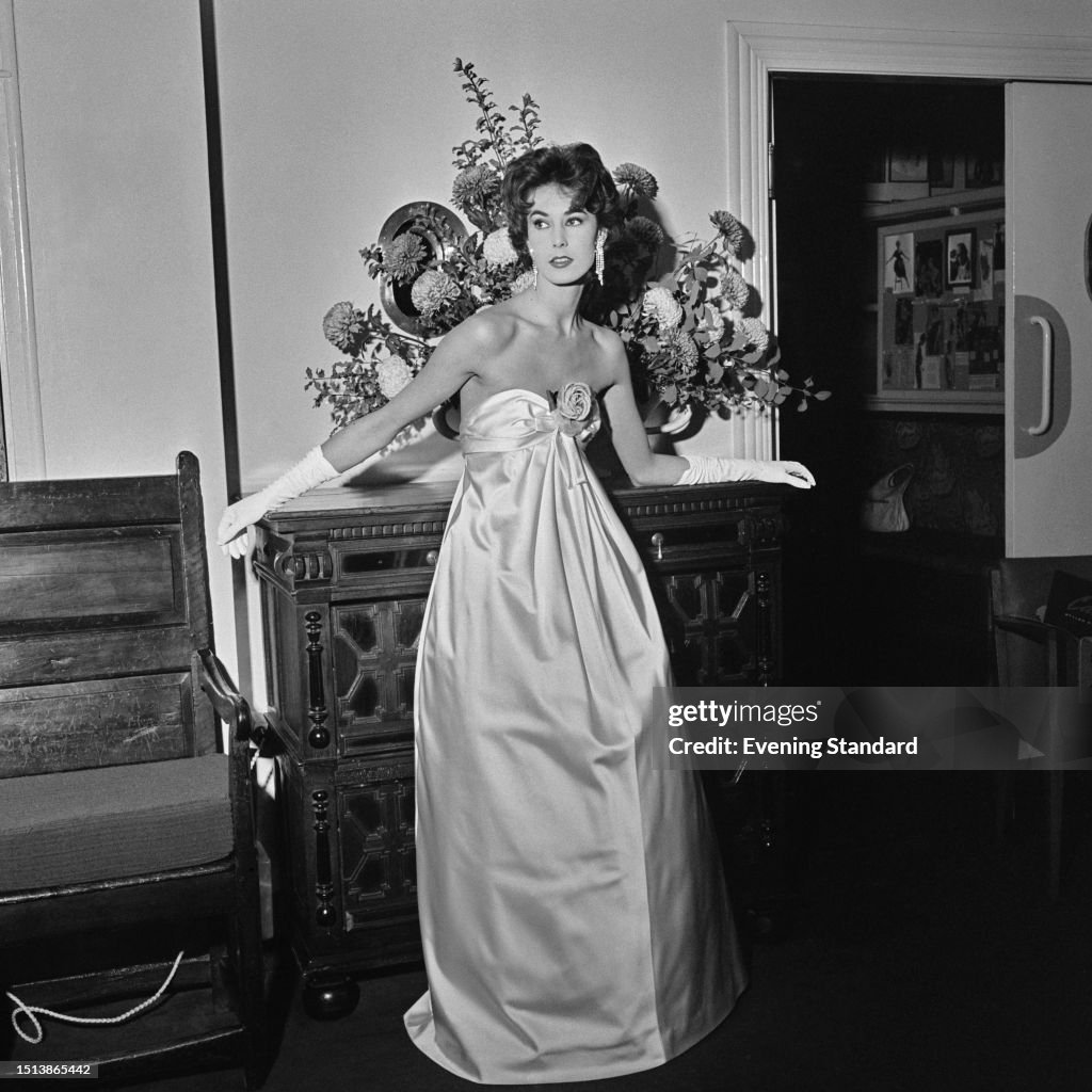 A Model In A Satin Ball Gown