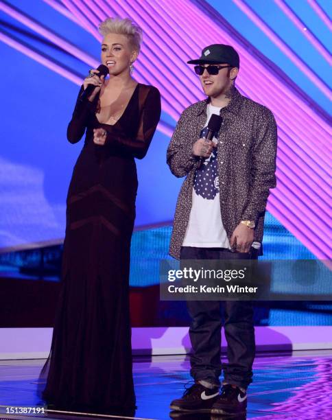 Singer Miley Cyrus and rapper Mac Miller speak onstage during the 2012 MTV Video Music Awards at Staples Center on September 6, 2012 in Los Angeles,...