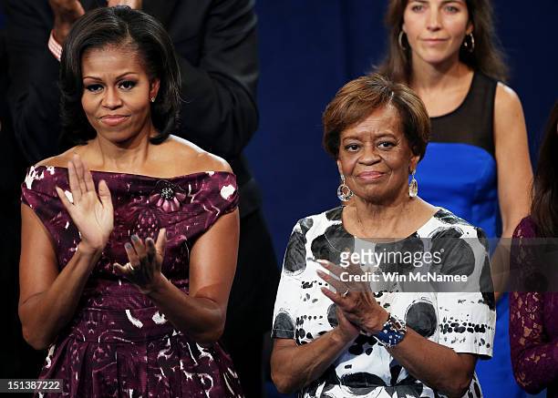 First lady Michelle Obama applauds with her mother Marian Robinson during the final day of the Democratic National Convention at Time Warner Cable...