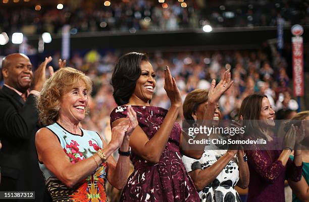 First lady Michelle Obama applauds with her mother Marian Robinson during the final day of the Democratic National Convention at Time Warner Cable...