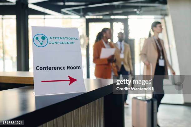 conference room sign on reception desk at convention center - lobby stock pictures, royalty-free photos & images