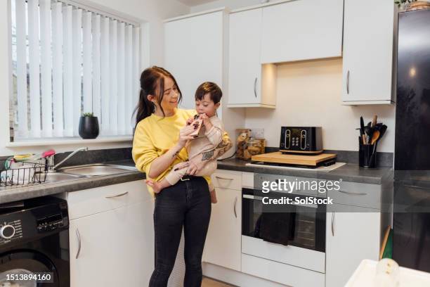 mother duties - home interior stock pictures, royalty-free photos & images