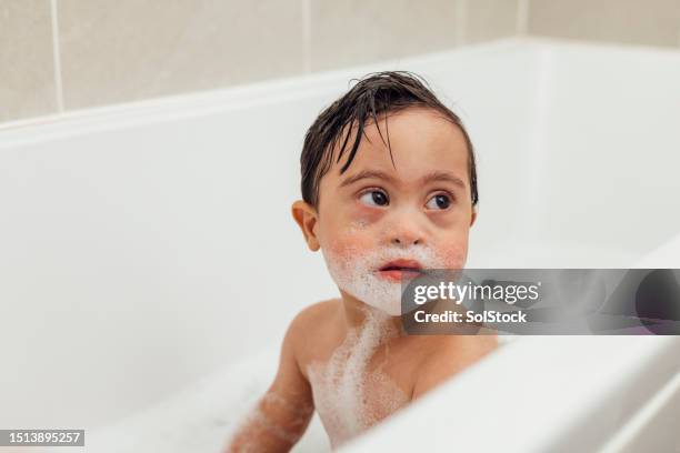 boy with a bubble beard - babyhood stock pictures, royalty-free photos & images