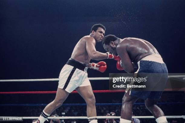 Heavyweight boxers Muhammad Ali and Joe Frazier in action during the second round of their championship fight in Quezon City, Metro Manila,...