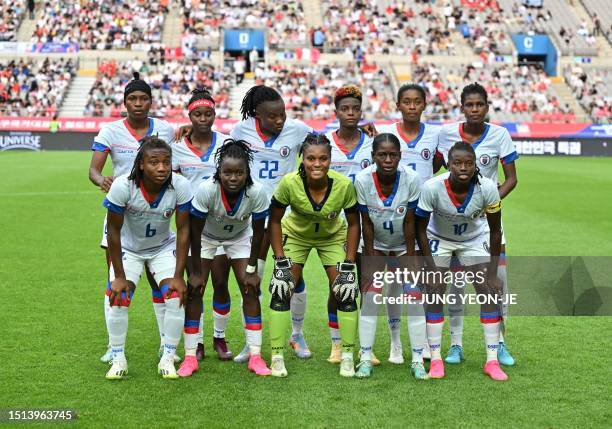 Haiti's players pose for a team photo during the women's international friendly football match between South Korea and Haiti in Seoul on July 8 ahead...