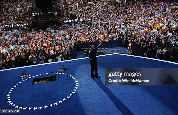 Democratic presidential candidate, U.S. President Barack Obama waves on stage after accepting the nomination during the final day of the Democratic...