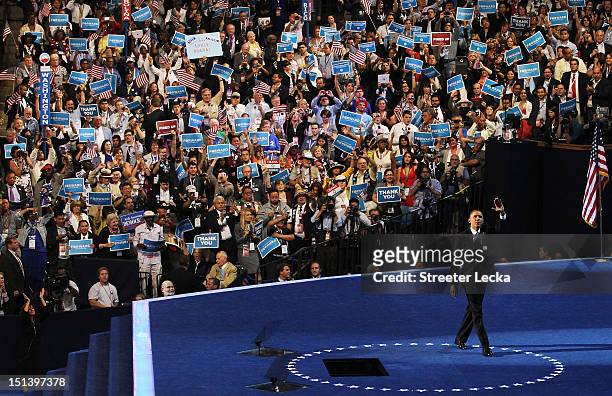 Democratic presidential candidate, U.S. President Barack Obama waves on stage after accepting the nomination during the final day of the Democratic...
