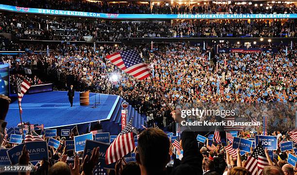 Democratic presidential candidate, U.S. President Barack Obama waves on stage after accepting the nomination during the final day of the Democratic...