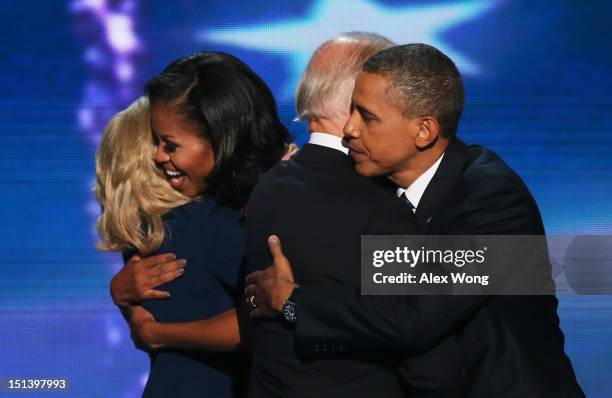 Second lady Dr. Jill Biden hugs First lady Michelle Obama, as Democratic vice presidential candidate, U.S. Vice President Joe Biden greets Democratic...