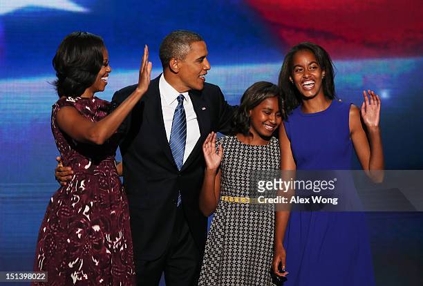 Democratic presidential candidate, U.S. President Barack Obama stands on stage with First lady Michelle Obama, Sasha Obama and Malia Obama after...