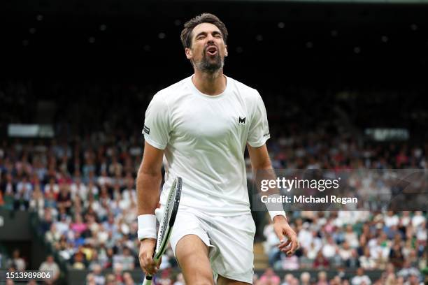 Jeremy Chardy of France reacts against Carlos Alcaraz of Spain in the Men's Singles first round match during day two of The Championships Wimbledon...