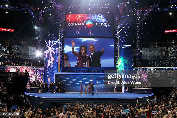 Democratic presidential candidate, U.S. President Barack Obama stands on stage with First lady Michelle Obama, Sasha Obama and Malia Obama after...