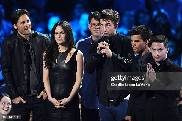 Actors Peter Facinelli, Elizabeth Reaser, director Bill Condon and actors Robert Pattinson, Taylor Lautner and Jackson Rathbone speak onstage at the...