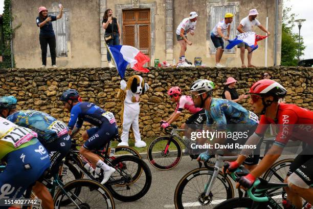 Mark Cavendish of United Kingdom and Astana Qazaqstan Team and a general view of the peloton competing while fans cheer during the stage four of the...