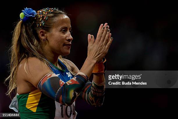 Terezinha Guilhermina of Brazil celebrates a victory and the gold medal in the Women's 100m - T11on day 7 of the London 2012 Paralympic Games at...
