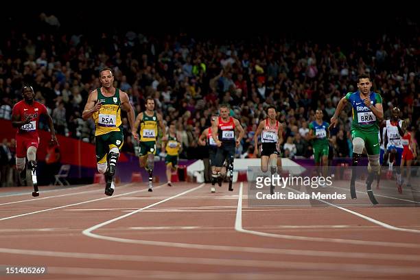 Oscar Pistorius of South Africa crosses the line to win gold for this team in the Men's 4x100m relay T42/T46 Final on day 7 of the London 2012...