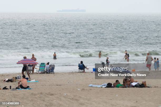 July 7: Beachgoers swim at Rockaway Beach at Beach 91st Street in Queens, New York City after a person was pulled from the water on Friday, July 7,...