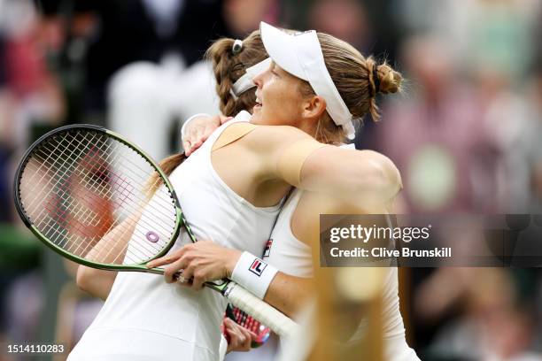 Elena Rybakina of Kazakhstan interacts with Shelby Rogers of United States following the Women's Singles first round match during day two of The...