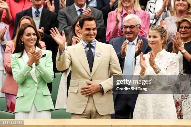 Catherine, Princess of Wales, Roger Federer of Switzerland and his wife Mirka Federer interact in the Royal Box prior to the Women's Singles first...