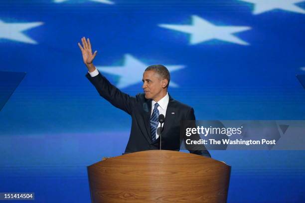 President Barack Obama waves to the audience as he prepares to deliver his nomination acceptance speech at the 2012 Democratic National Convention at...