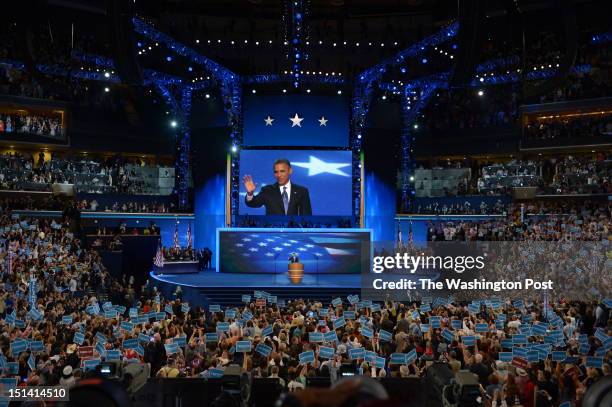 President Barack Obama waves to the audience as he prepares to deliver his nomination acceptance speech at the 2012 Democratic National Convention at...