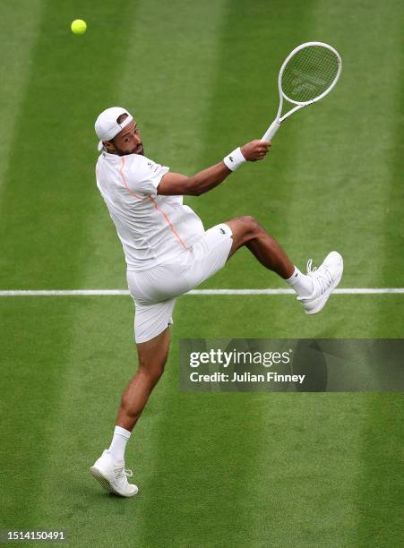 Laurent Lokoli of France leaves a smash against Casper Ruud of Norway in the Men's Singles first round match during day one of The Championships...