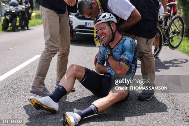 Astana Qazaqstan Team's British rider Mark Cavendish receives medical attention after suffering a crash during the 8th stage of the 110th edition of...