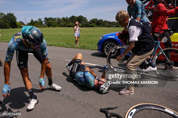 Astana Qazaqstan Team's British rider Mark Cavendish receives medical attention after suffering a crash during the 8th stage of the 110th edition of...