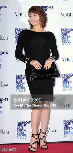 Kim Hae-Soo poses for photographs upon arrival during Vogue Fashion's Night Out 2012 Seoul at Shinsegae Department Store on September 6, 2012 in...