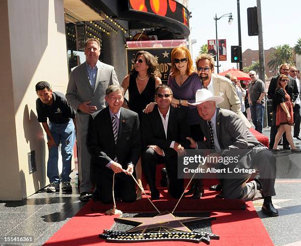 Chairman Christopher Barton, musician Amy Grant, musician Reba McEntire, producer Tony Brown, WOF CEO Leron Gubler, musician Vince Gill and...