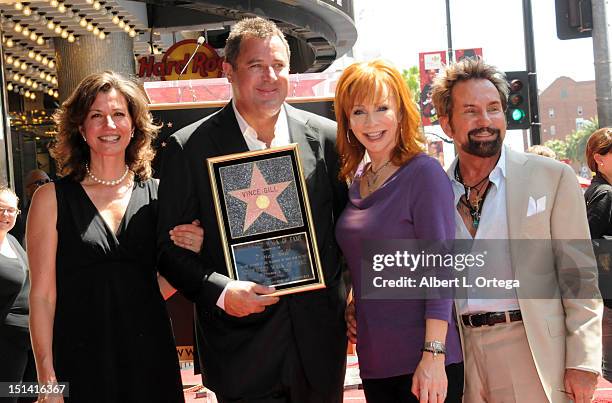 Musicians Amy Grant, Vince Gill, Reba McEntire and producer Tony Brown participate in the Star ceremony Honoring Vince Gill On The Hollywood Walk Of...