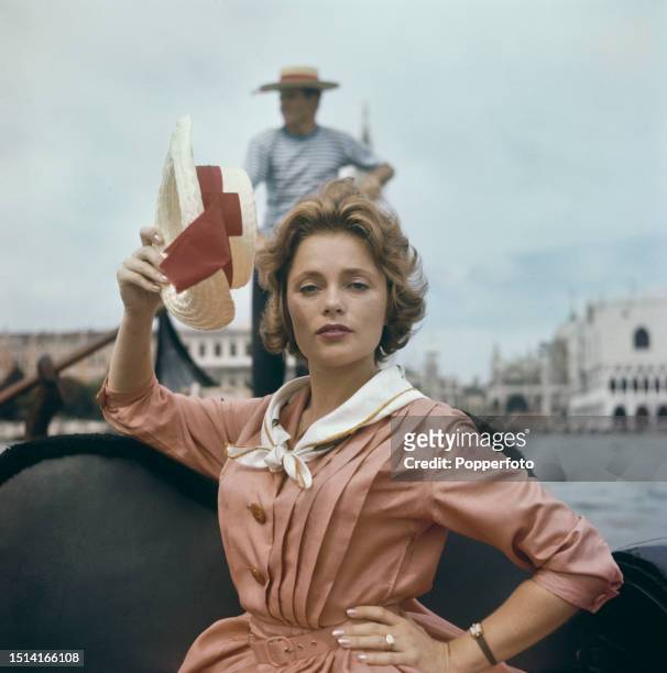 Swedish actress Ulla Jacobsson seated in a gondola on the Grand Canal in front of the Doge's Palace during the 1960 Venice International Film...