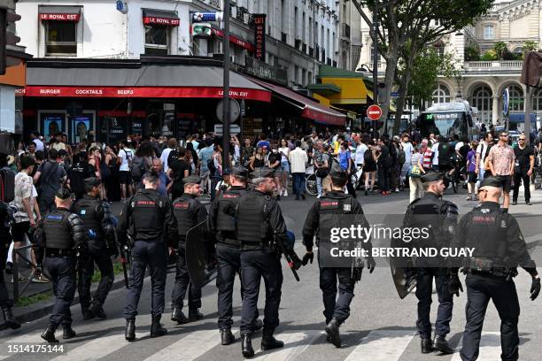 Riot mobile gendarmes face protesters during the "March for Adama Traore" - seven years after his death - at Gare de l'Est in Paris on July 8, 2023....