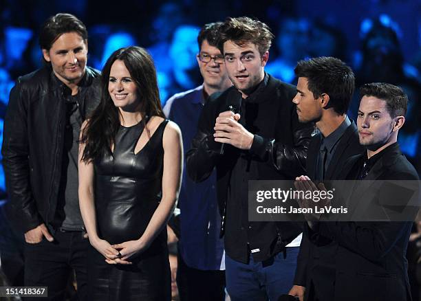 Actors Peter Facinelli, Elizabeth Reaser, director Bill Condon and actors Robert Pattinson, Taylor Lautner and Jackson Rathbone speak onstage at the...