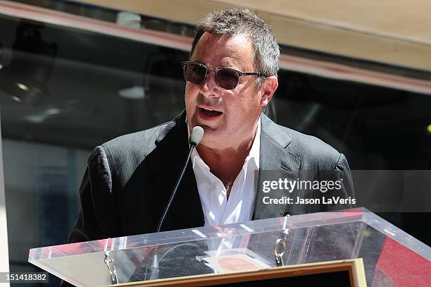 Vince Gill is honored with a star on the Hollywood Walk of Fame on September 6, 2012 in Hollywood, California.