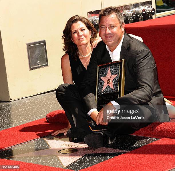 Vince Gill and Amy Grant attend Gill's induction into the Hollywood Walk of Fame on September 6, 2012 in Hollywood, California.