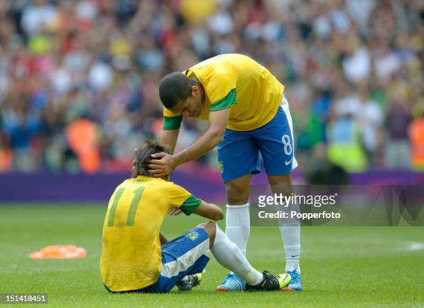Romulo of Brazil comforts team-mate Neymar after their defeat in the Men's Football Final between Brazil and Mexico on Day 15 of the London 2012...