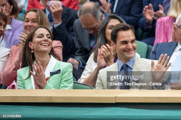 Roger Federer of Switzerland with Her Royal Highness, Catherine, Princess of Wales in the Centre Court's Royal Box during the Wimbledon Lawn Tennis...