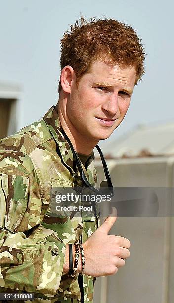 Prince Harry gives a thumbs-up as he examines the Apache flight-line at Camp Bastion on September 7, 2012 in Helmand Province, Afghanistan. Prince...