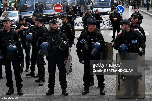Riot mobile gendarmes face protesters during the "March for Adama Traore" - seven years after his death - at Gare de l'Est in Paris on July 8, 2023....