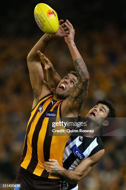 Lance Franklin of the Hawks marks infront of Chris Tarrant of the Magpies during the First AFL Qualifying Final match between the Hawthorn Hawks and...