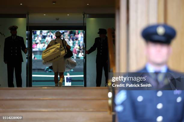 Andy Murray of Great Britain takes to the court against Ryan Peniston of Great Britain in the Men's Singles first round match during day two of The...