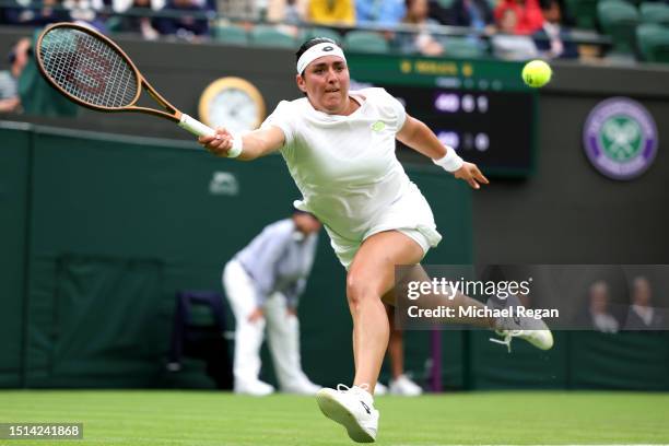 Ons Jabeur of Tunisia stretches to play a forehand against Magdalena Frech of Poland in the Women's Singles first round match during day two of The...