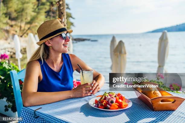 lunch by the sea - greek salad stock pictures, royalty-free photos & images